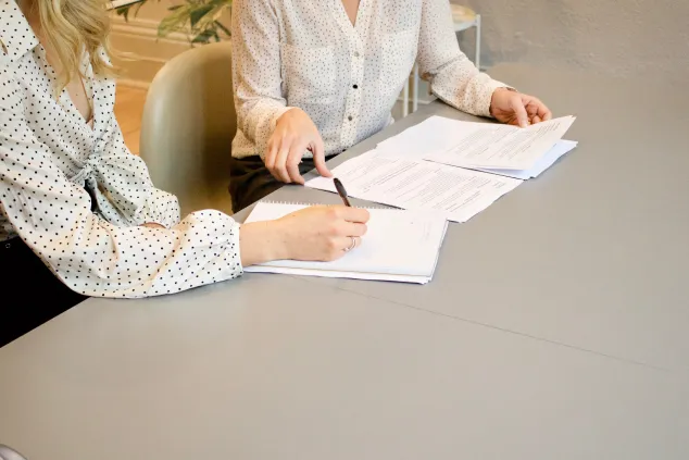 Lady writing in a book